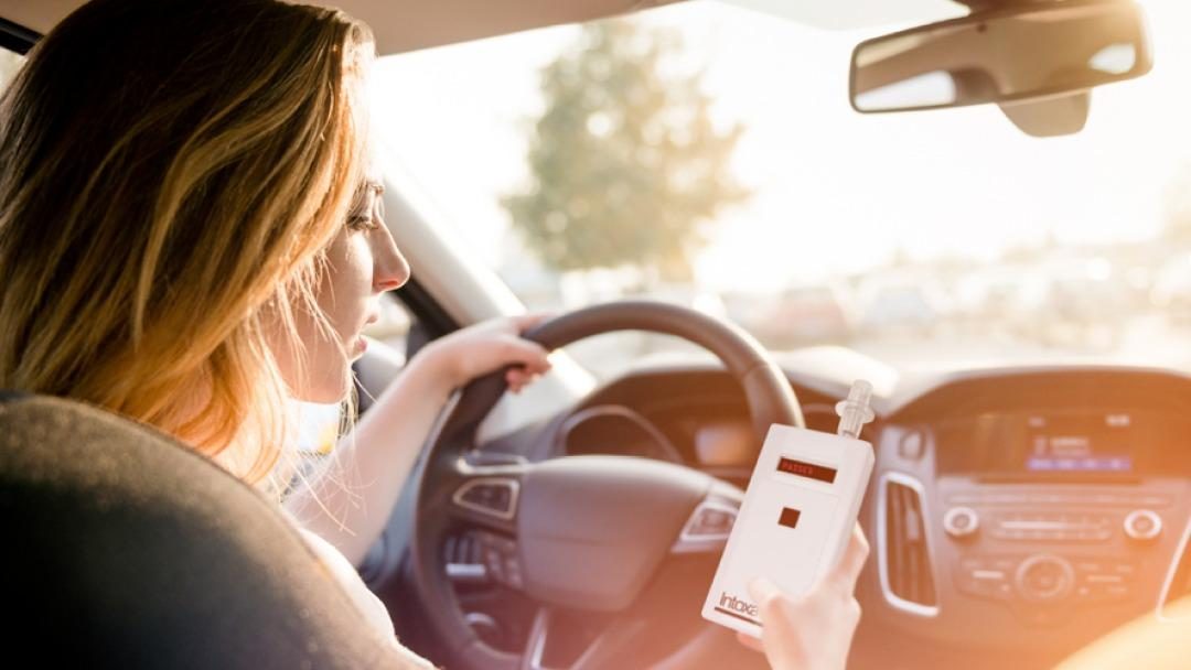 Driver using an Intoxalock ignition interlock device installed by Ambler Service & Repair
